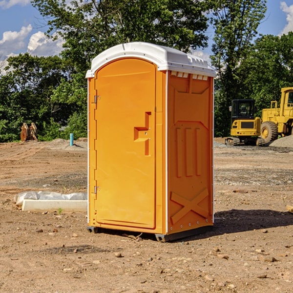 what is the cost difference between standard and deluxe portable restroom rentals in Bramwell